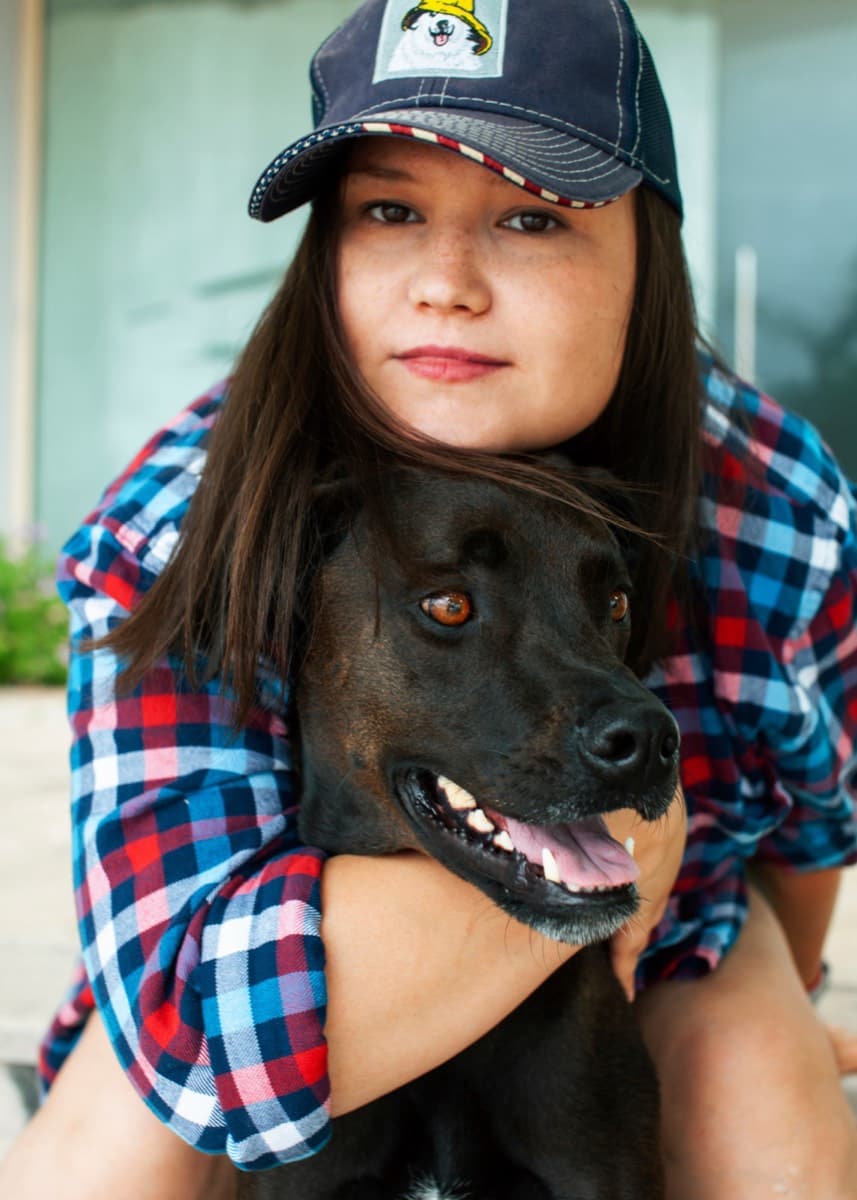 Anastasia with Sage, their rescue dog